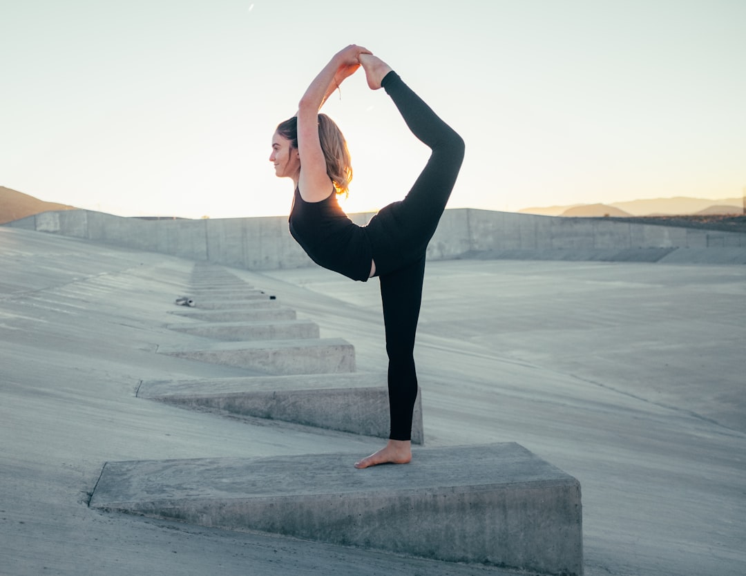 our-journey-01 shallow-focus-photo-of-woman-in-black-sleeveless-shirt-doing-yoga-nzynzmr3ls