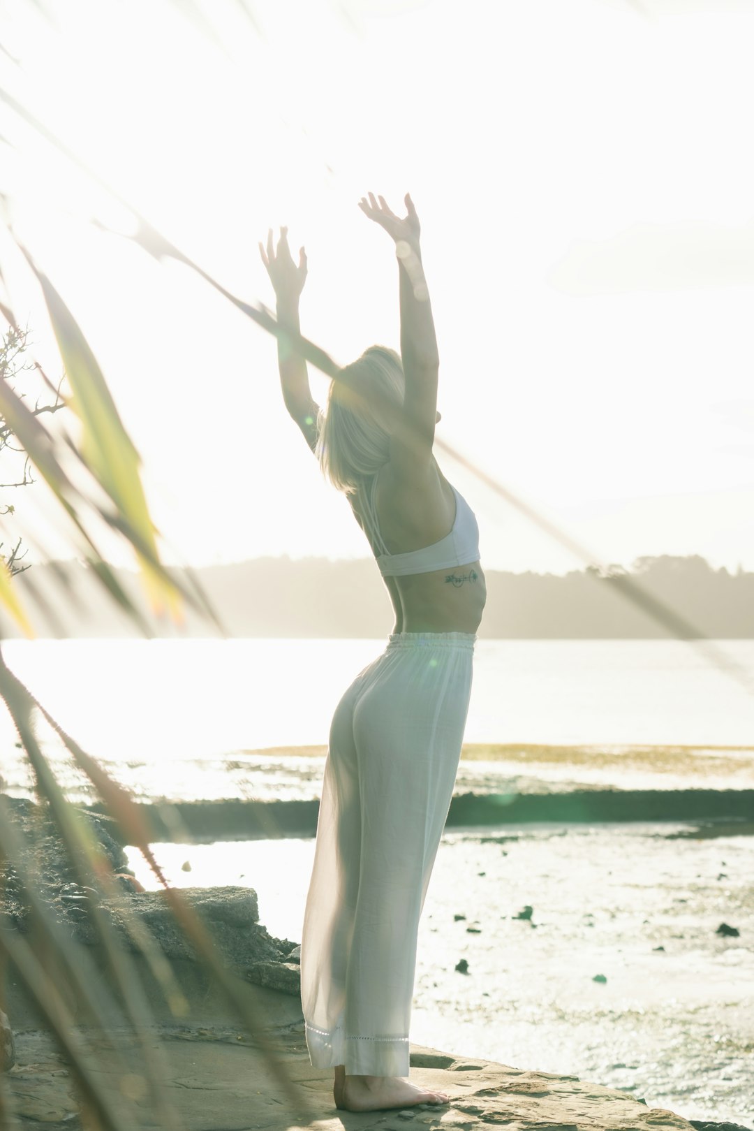 who-we-are woman-standing-near-body-of-water-zdldggbi9ow