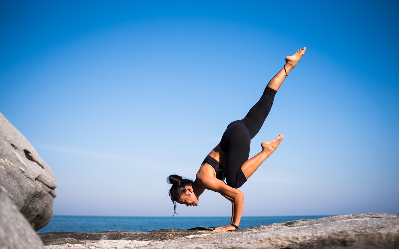 yoga, strength, woman, balance, balancing, fit, fitness, young woman, fit woman, wellness, pose, nature, yoga pose, posing, strength training, meditation, health, outdoors, beach, international yoga day